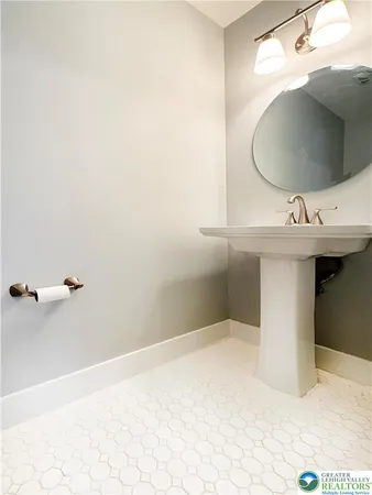 a bathroom with a sink and mirror