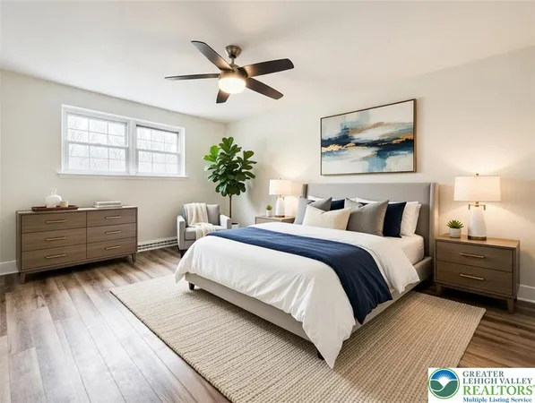 a bedroom with bed and paintings on the wall