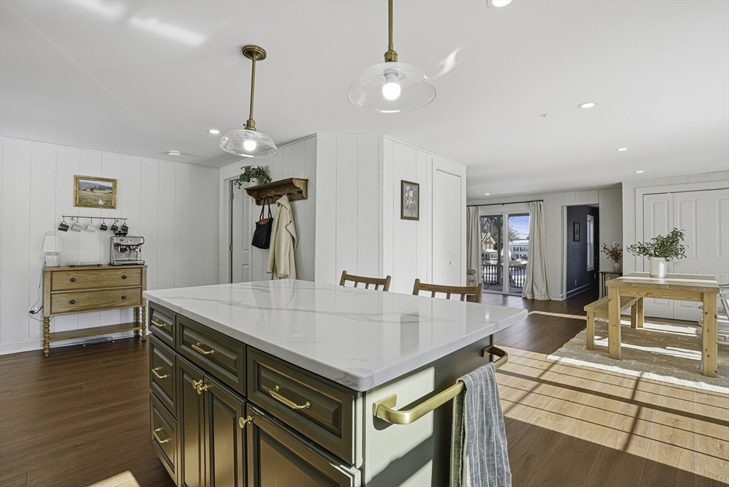 26 Maple Street Mendon, MA 01756 - Photo 12 of 42 a living room with dining table and wooden floor