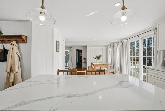 a view of a livingroom with furniture and ceiling fan