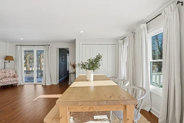 a room with pool table and wooden floor