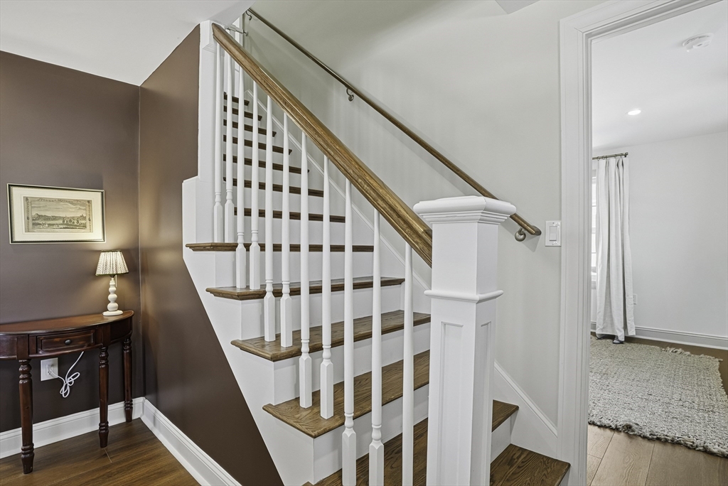 26 Maple Street Mendon, MA 01756 - Photo 25 of 42 a view of staircase with lots of frames on wall and a window