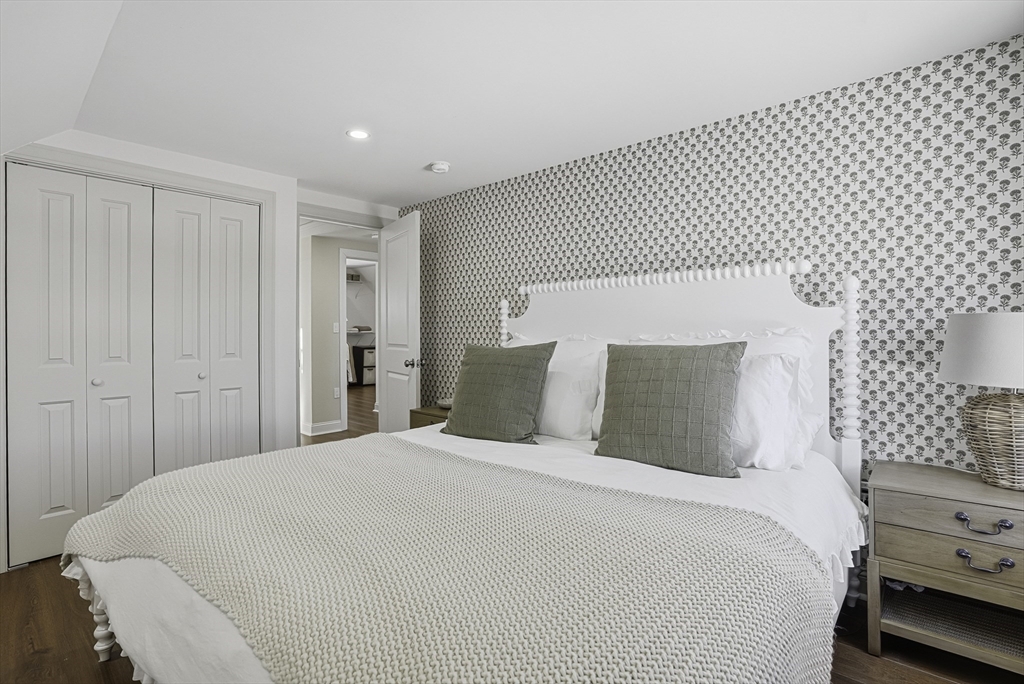 26 Maple Street Mendon, MA 01756 - Photo 30 of 42 a bedroom with a bed and a chair