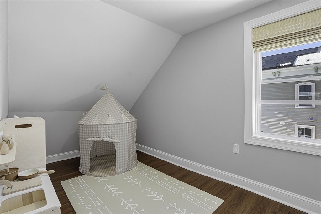 26 Maple Street Mendon, MA 01756 - Photo 31 of 42 a room with a fireplace and a window