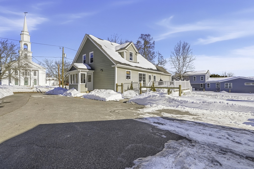 26 Maple Street Mendon, MA 01756 - Photo 41 of 42 front view of a house with a street