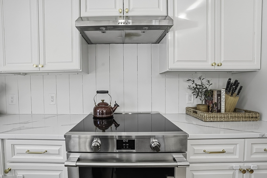 26 Maple Street Mendon, MA 01756 - Photo 10 of 42 a kitchen with a stove and cabinets