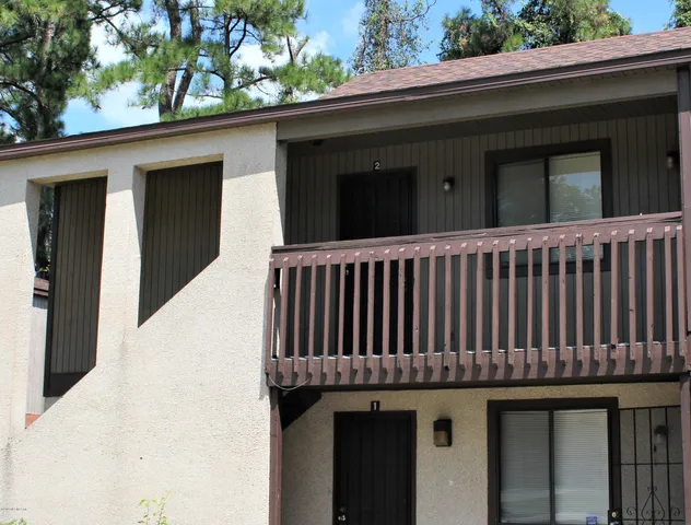 a view of a brick house with a window
