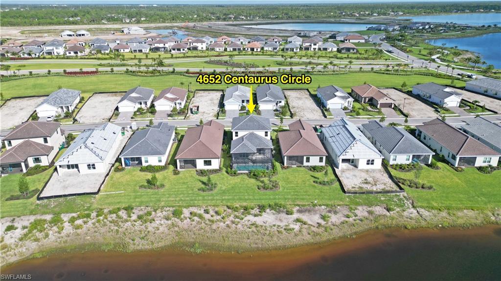 4652 Centaurus Circle Naples, FL 34120 - Photo 41 of 45 Aerial view of residential area with a nearby body of water