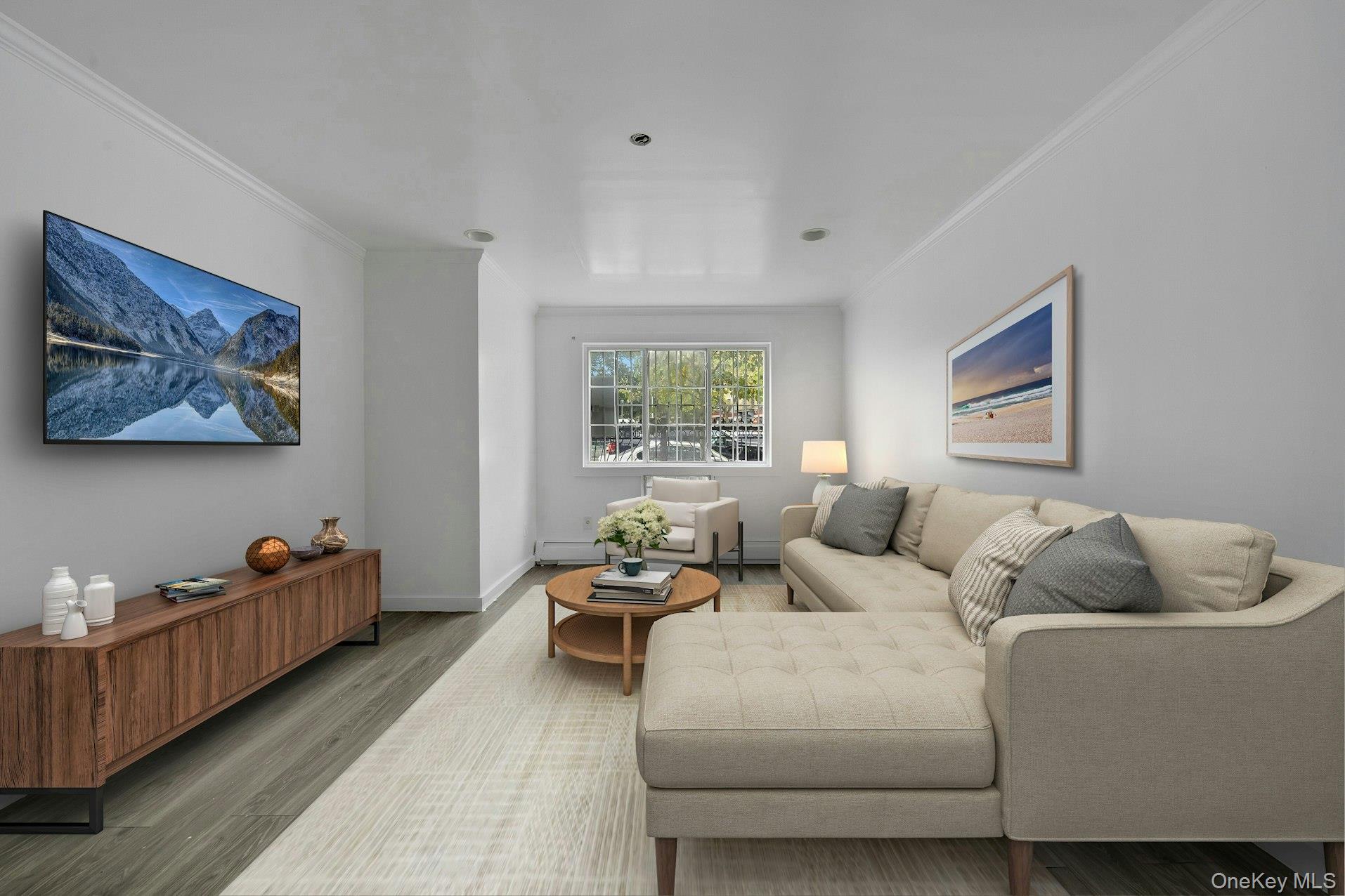 Living room featuring crown molding and wood finished floors