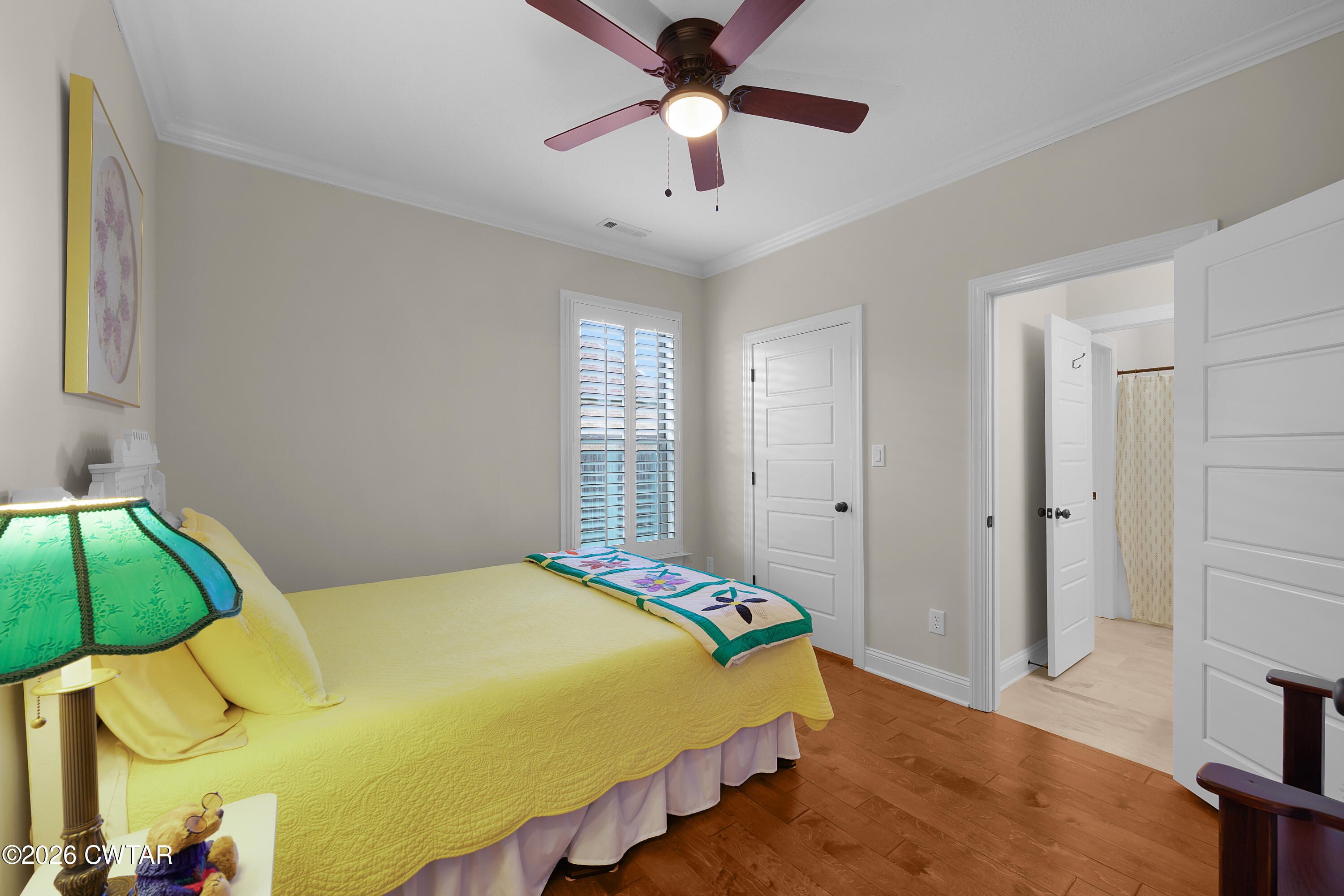 34 Cheddleton Cove Jackson, TN 38305 - Photo 17 of 32 a bedroom with a bed and a ceiling fan