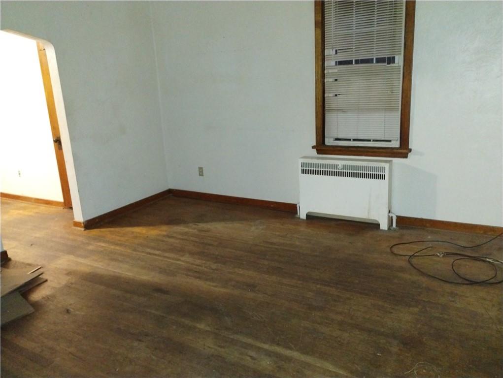 803 11th Street McKees Rocks, PA 15136 - Photo 5 of 14 an empty room with wooden floor and windows
