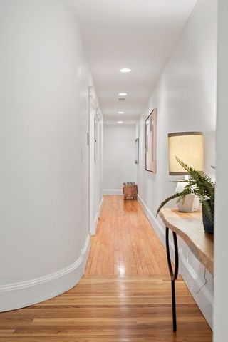 a room with wooden floor and furniture