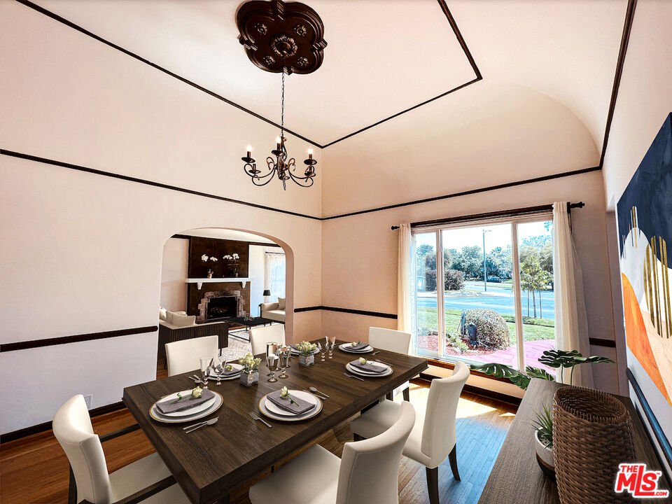 6187 Barrows Drive Los Angeles, CA 90048 - Photo 6 of 35 a view of a dining room with furniture window and outside view