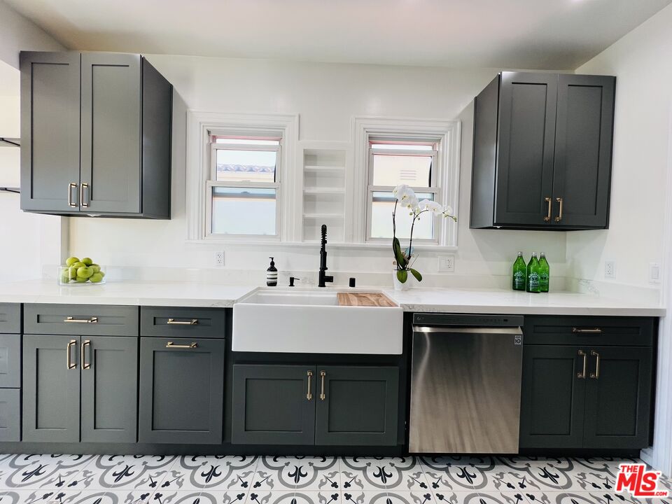 6187 Barrows Drive Los Angeles, CA 90048 - Photo 10 of 35 a kitchen with a sink cabinets and wooden floor
