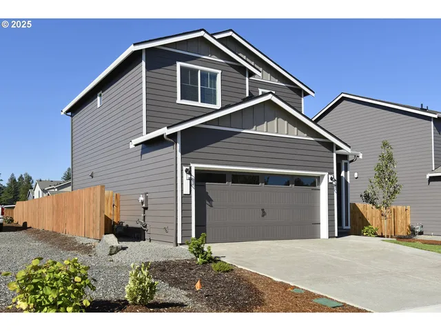 a front view of a house with a garage