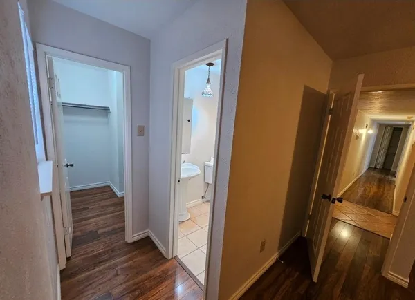 a bathroom with a toilet sink and shower