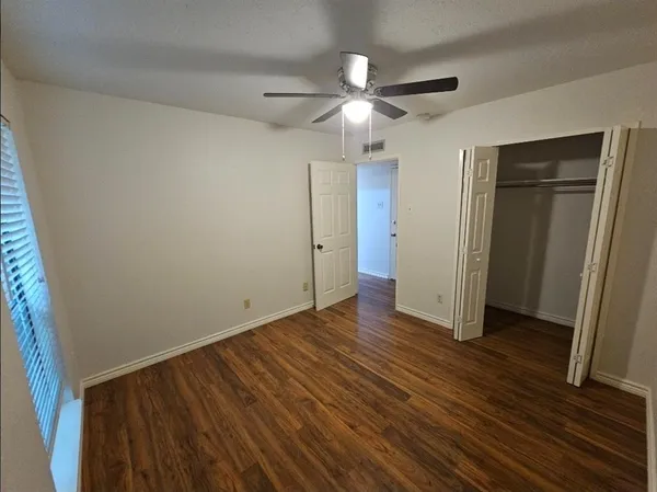 a view of entryway with wooden floor