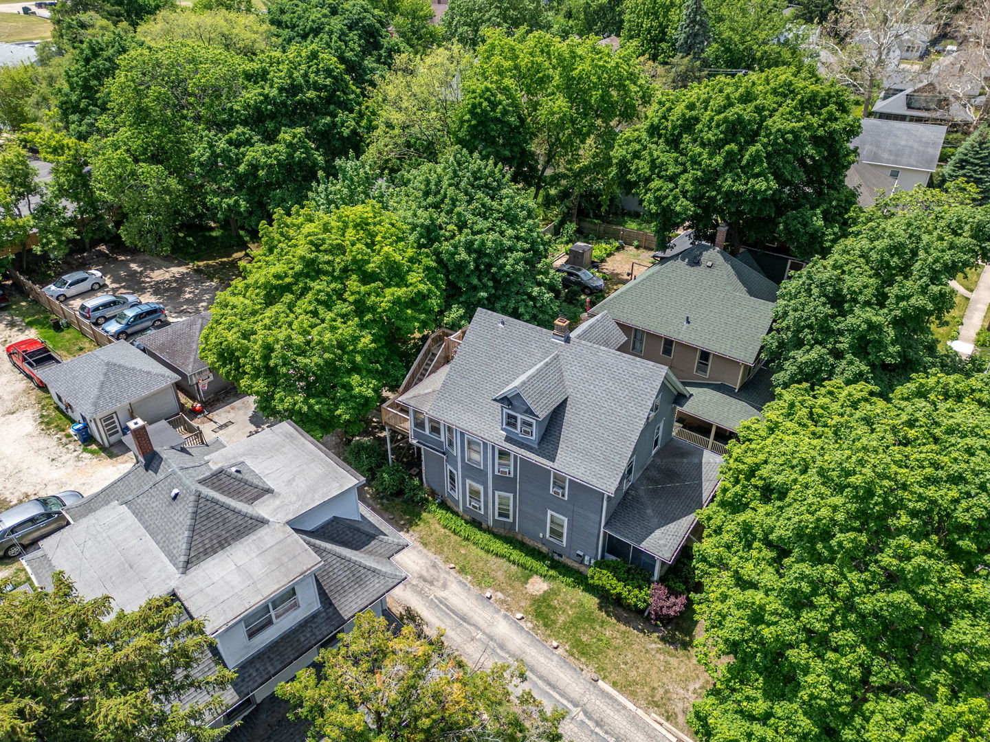 226 West Locust Street DeKalb, IL 60115 - Photo 5 of 40 an aerial view of a house with a big yard and large tree