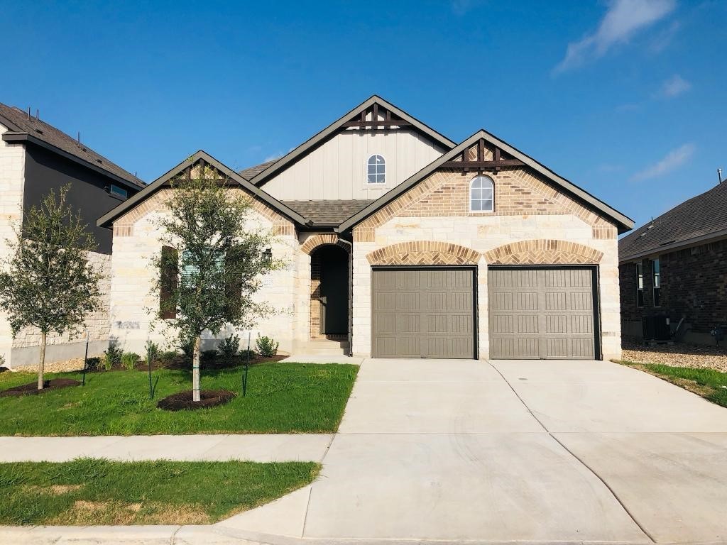 2225 Base Burner Path Leander, TX 78641 - Photo 1 of 1 a front view of a house with a yard and garage
