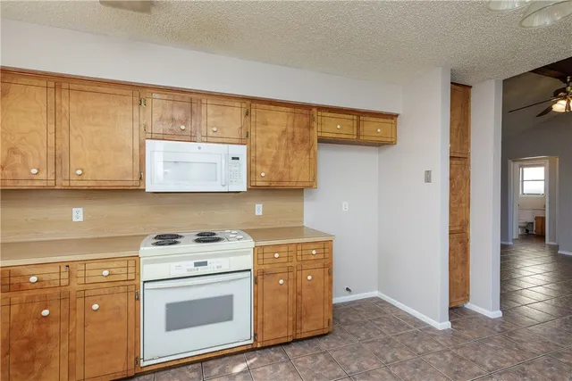 a kitchen with a stove and a cabinet