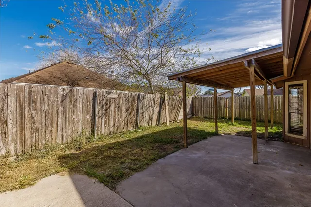 a view of outdoor space with wooden fence
