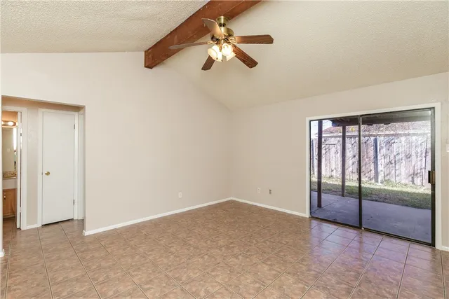 an empty room with fan