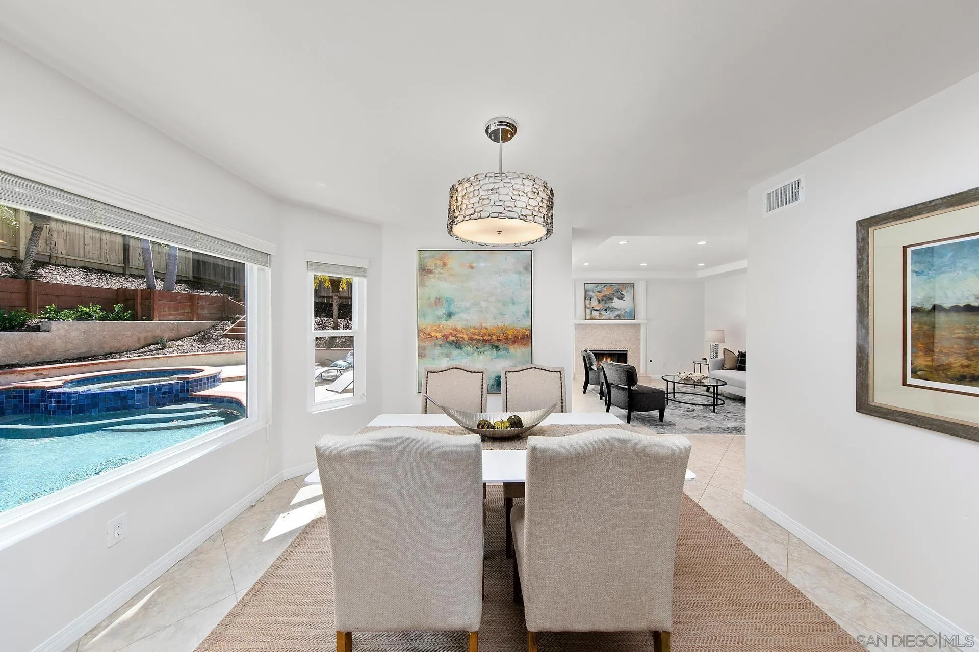 1971 Avenida Joaquin Encinitas, CA 92024 - Photo 11 of 33 a living room with furniture a chandelier and a flat screen tv