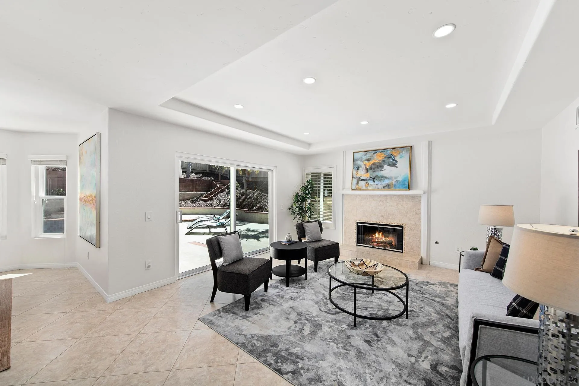 1971 Avenida Joaquin Encinitas, CA 92024 - Photo 12 of 33 a living room with furniture a fireplace and a table