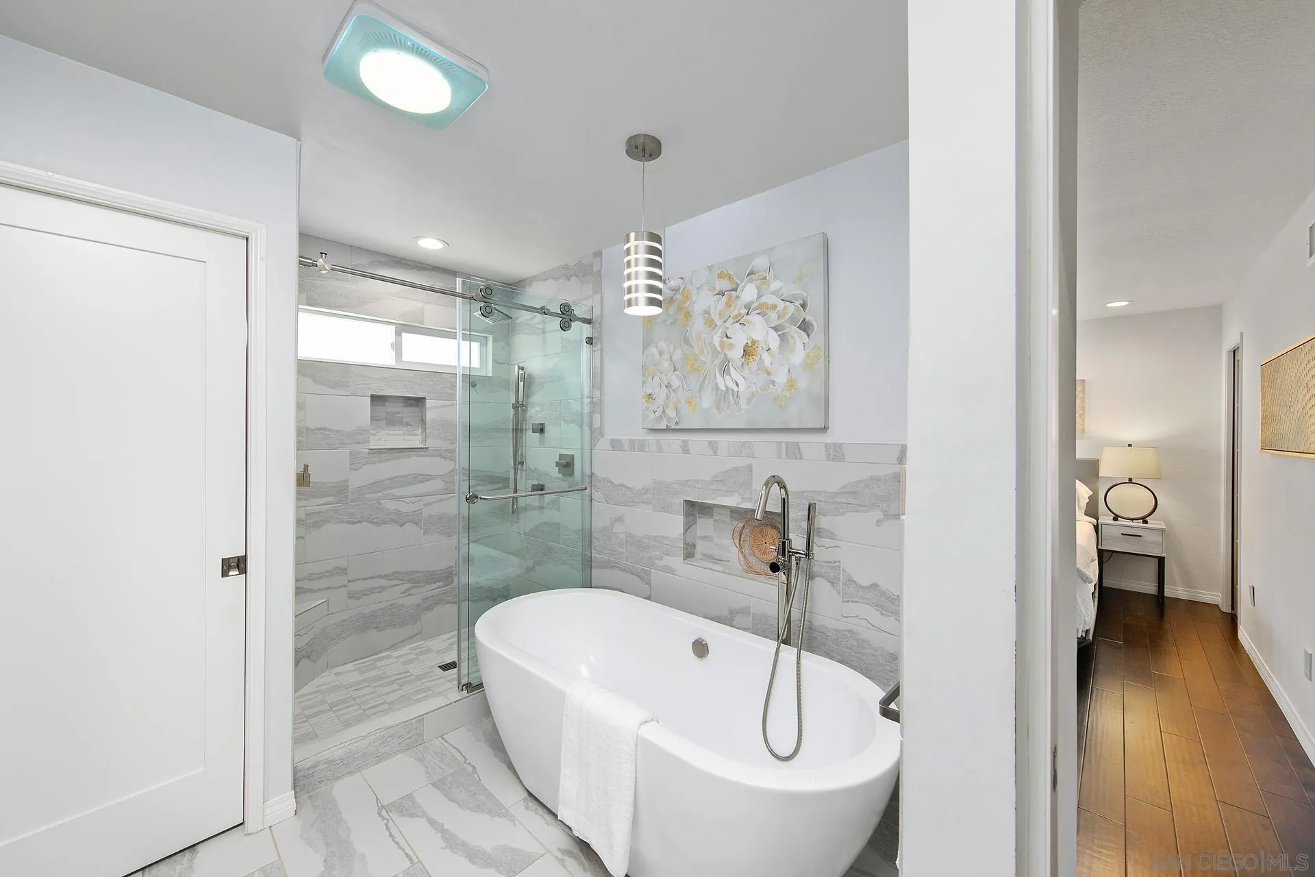 1971 Avenida Joaquin Encinitas, CA 92024 - Photo 17 of 33 a bathroom with a white bath tub a shower and a sink