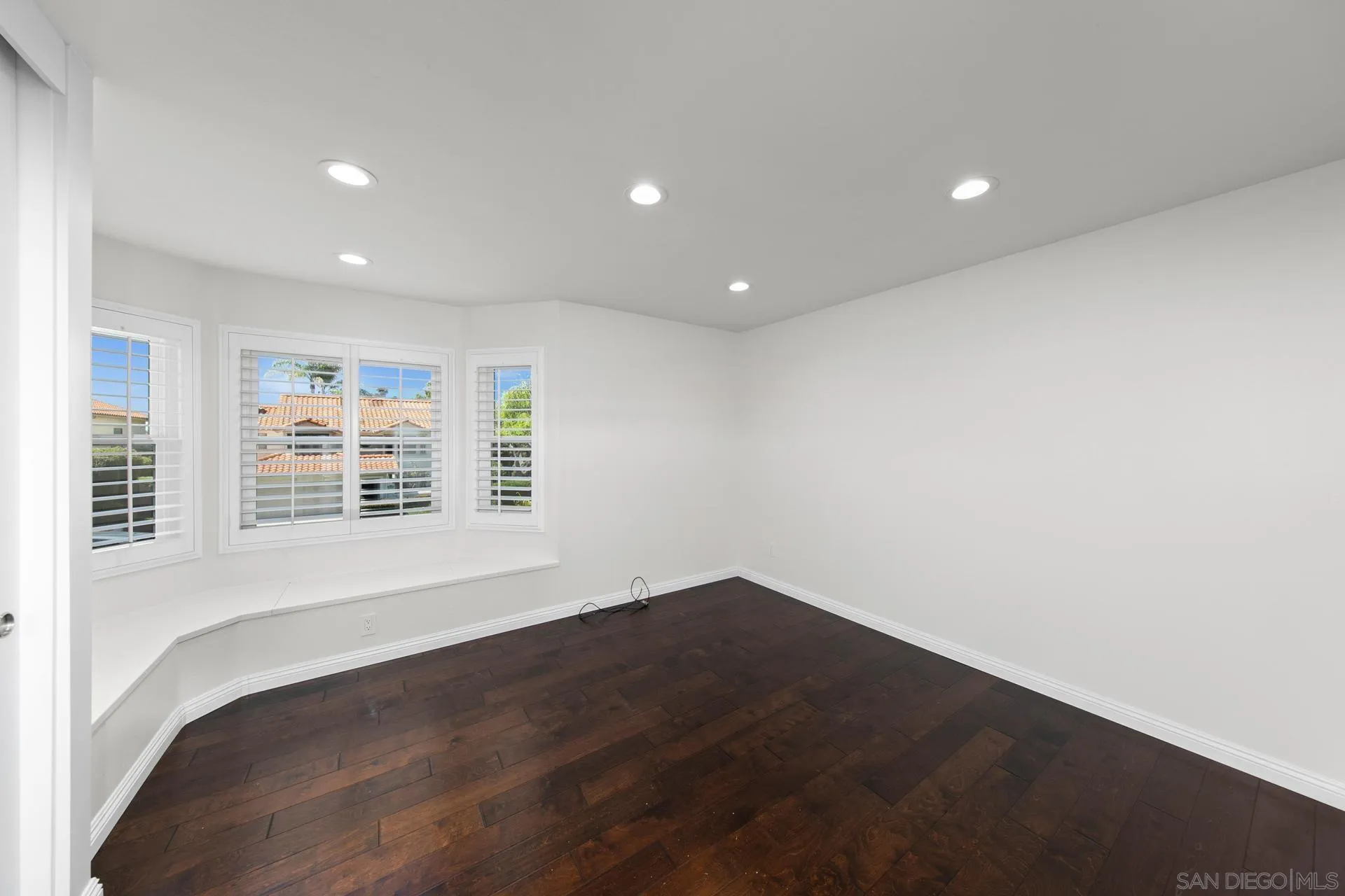1971 Avenida Joaquin Encinitas, CA 92024 - Photo 20 of 33 an empty room with wooden floor and windows