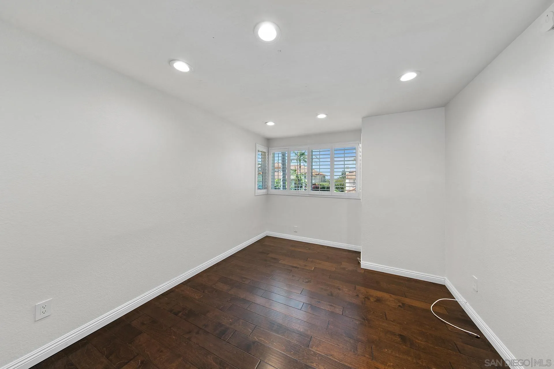 1971 Avenida Joaquin Encinitas, CA 92024 - Photo 25 of 33 an empty room with wooden floor and windows