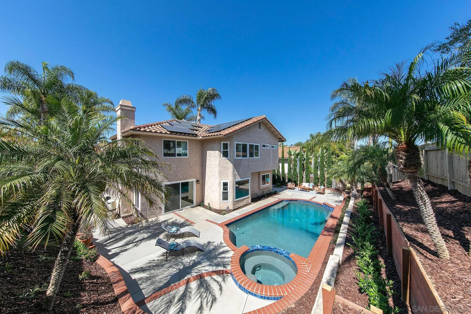 1971 Avenida Joaquin Encinitas, CA 92024 - Photo 26 of 33 a view of a house with backyard water fountain and sitting area