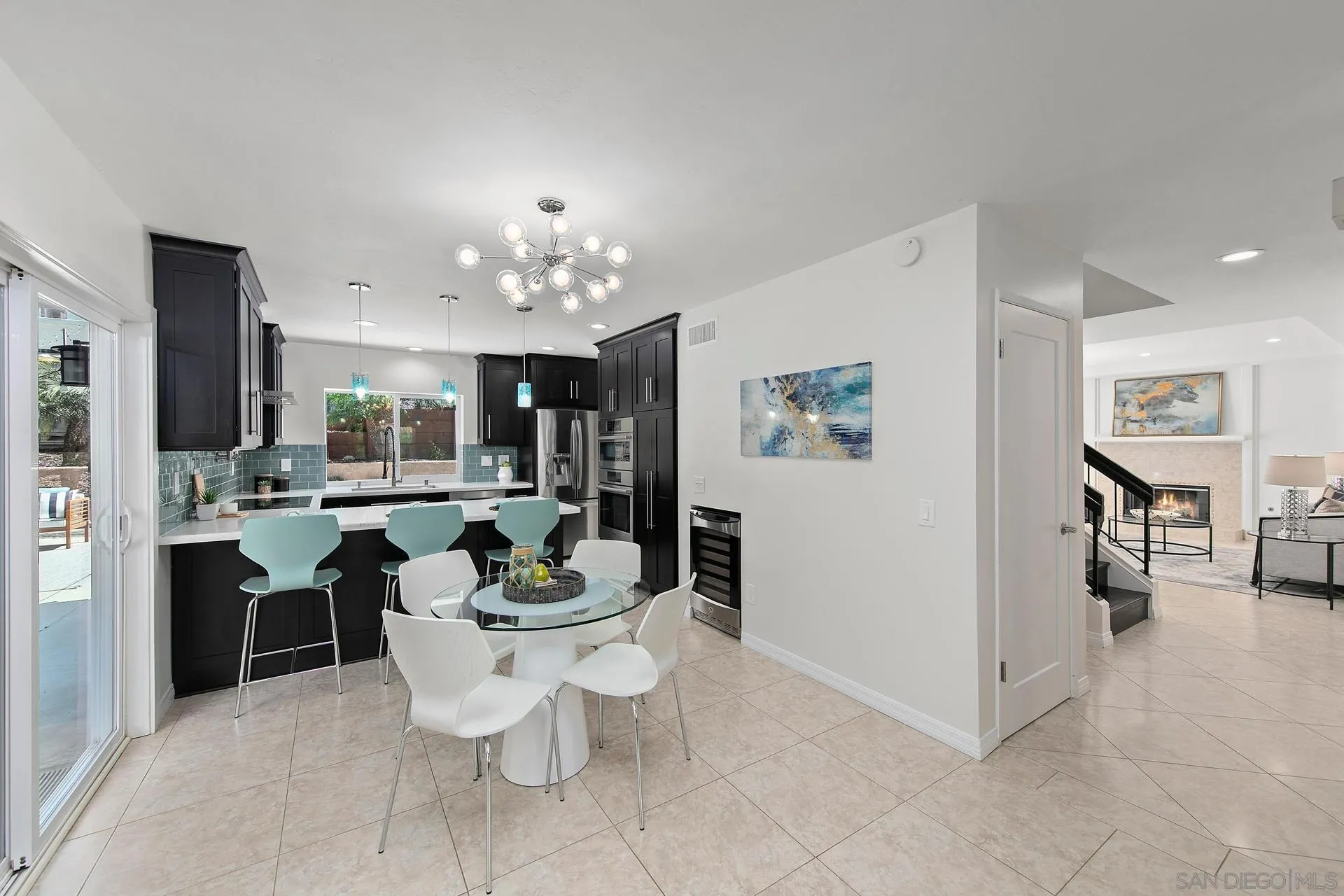 1971 Avenida Joaquin Encinitas, CA 92024 - Photo 6 of 33 a living room with furniture a dining table and chairs