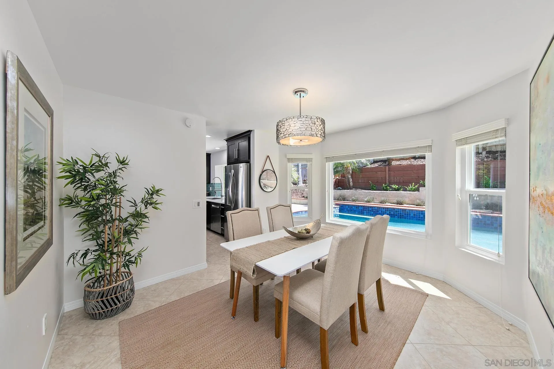 1971 Avenida Joaquin Encinitas, CA 92024 - Photo 10 of 33 a view of a dining room with furniture and chandelier