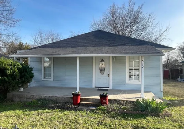 a front view of a house with yard