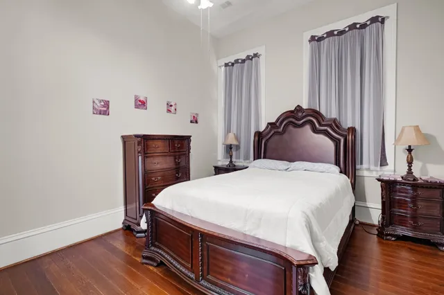 a bedroom with a bed and a dresser