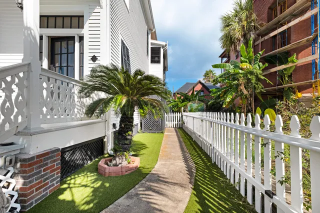a balcony with beautiful flowers and wooden floor