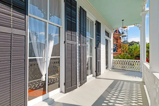 a view of a wrought iron fences in front of house