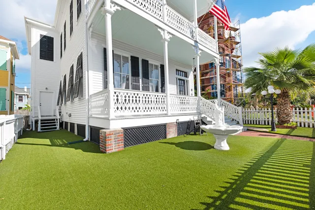 a view of a building with a garden and plants