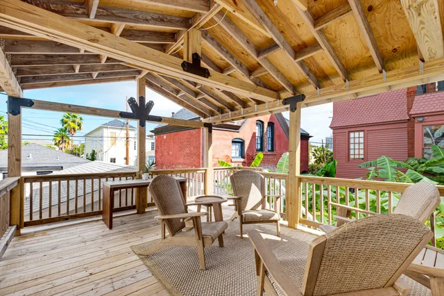 a view of a chairs and table in the balcony