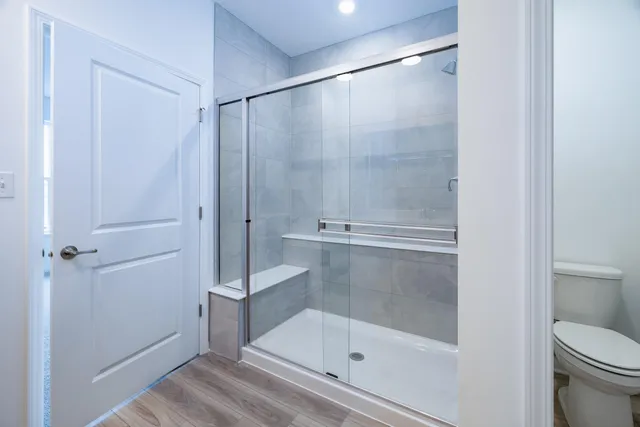 a bathroom with a glass shower door