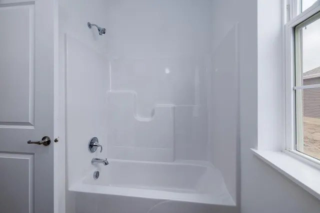 a close up of a bathtub curtain