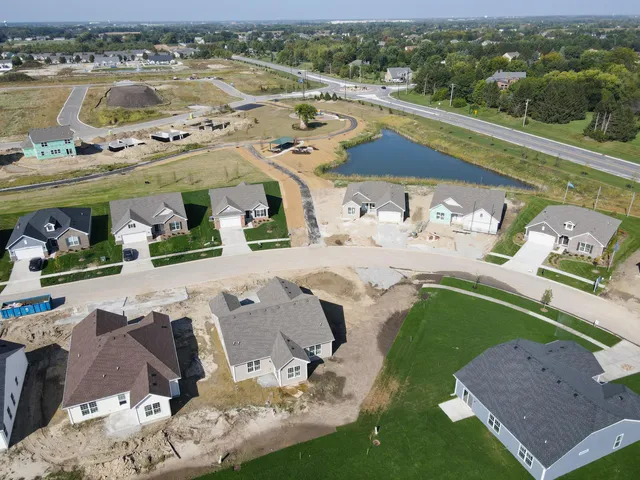 an aerial view of a house with a ocean view