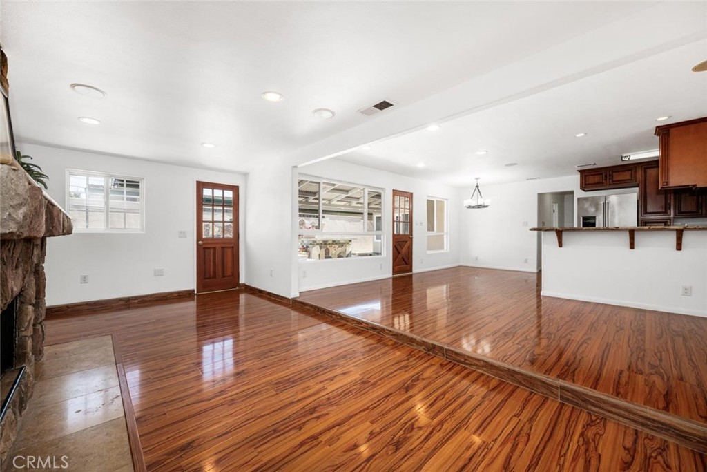 1238 North Studebaker Road Long Beach, CA 90815 - Photo 7 of 47 a view of a room with kitchen island and wooden floor