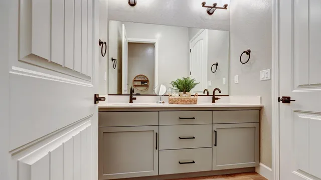 a bathroom with a sink and a mirror