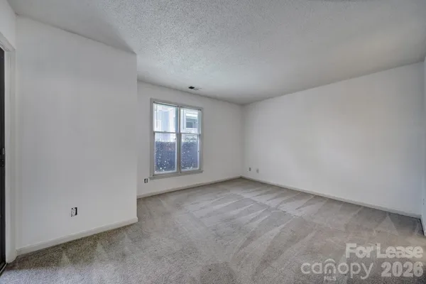 an empty room with windows and view