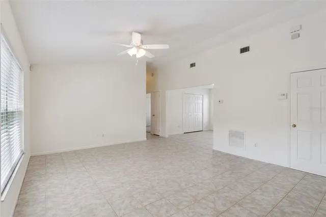 a view of an empty room with a window
