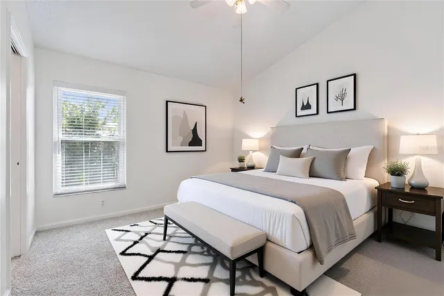 a bedroom with bed and a window