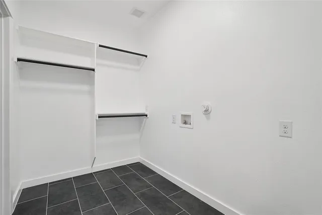 a view of an empty walk in closet