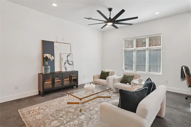a living room with furniture a window and a table